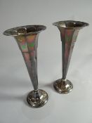 A pair of circular-based, faceted trumpet vases with flared necks, Sheffield 1919, 9 ins high (