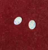 A pair of loose small opals