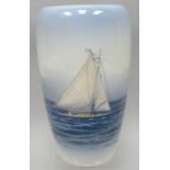 A Royal Copenhagen baluster vase decorated with racing yacht in calm seas, 7.75 ins high (19 cms)