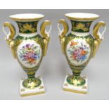 A pair of square based Limoges campana-shape vases with twin handles in green glaze with gilt