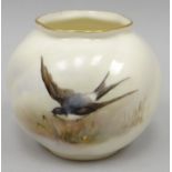 A Royal Worcester blush ivory small globular vase, decorated with a swallow in flight over