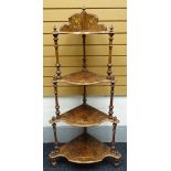 A burr-walnut and marquetry what-not composed of four graduated shaped shelves on turned-supports (