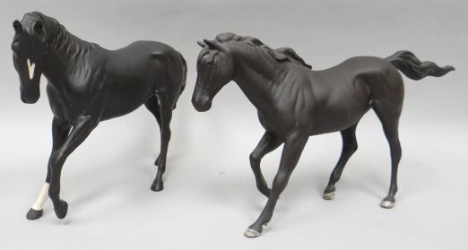 Two Royal Doulton standing sculptures of playful black horses in matt finish