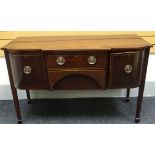 A Regency style inlaid and crossbanded mahogany break-front sideboard composed of two centre drawers