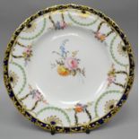 A Royal Crown Derby plate, finely painted with a centre sprig of flowers and six posies to the