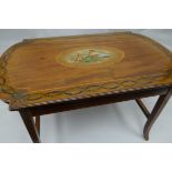 An interesting painted table, the top of shaped oblong form and featuring a centre oval cameo