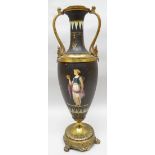 An early twentieth century black basalt and gilt metal mounted twin-handled table-lamp, painted with