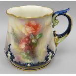A Hadley's of Worcester blush ivory, blue glazed and gilded mug of flared form painted all-round