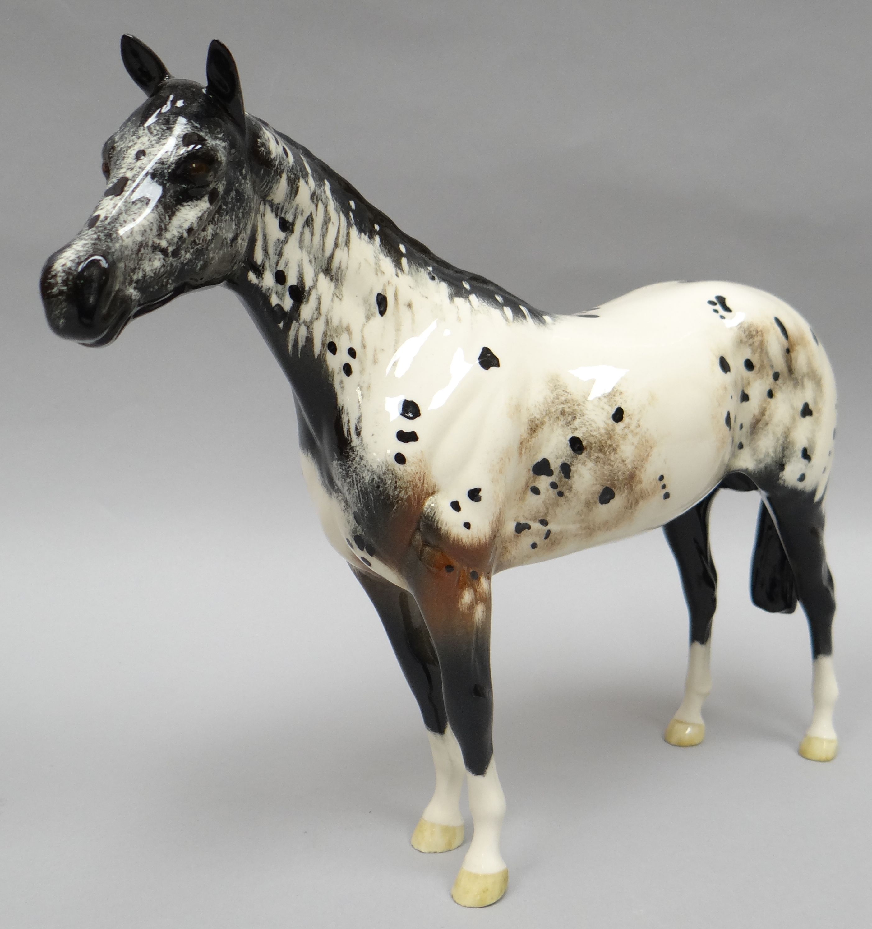 A Royal Doulton standing sculpture of a dappled brown and white horse 'Apaloosa' in gloss finish