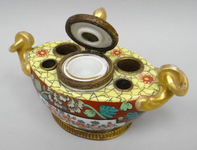 A believed French enamelled porcelain and gilt-metal pen-stand and inkwell, gondola-shaped, floral