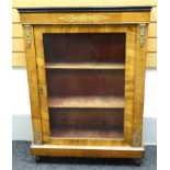 A mid-Victorian, ormolu-mounted and ebonised, marquetry walnut pier-cabinet having a single glazed