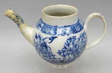 An eighteenth century blue and white English transferware teapot with depiction of doves to each