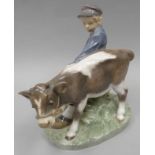 A Royal Copehagen porcelain model of a cap wearing boy struggling to control a grey and white