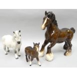 Three Royal Doulton standing sculptures of horses - a brown shire horse, a dappled grey 'Welsh