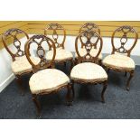 A set of six fine quality Victorian walnut drawing-room chairs with over-stuffed seats and having