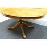 A fine quality mid-Victorian burr walnut oval centre-table, the highly-decorative base composed of