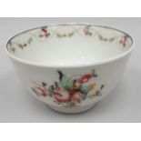 An eighteenth-century New Hall tea-bowl, floral decorated to the interior and extrerior