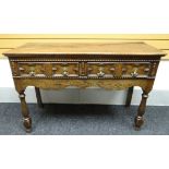 An eighteenth century and later oak two-drawer dresser-base with Jacobean-style geometric moulding