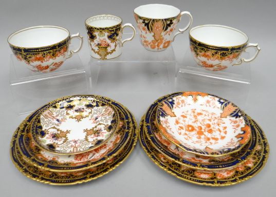 A pair of Royal Crown Derby Imari patterned trios; together with a matching coffee-can and saucer