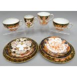 A pair of Royal Crown Derby Imari patterned trios; together with a matching coffee-can and saucer