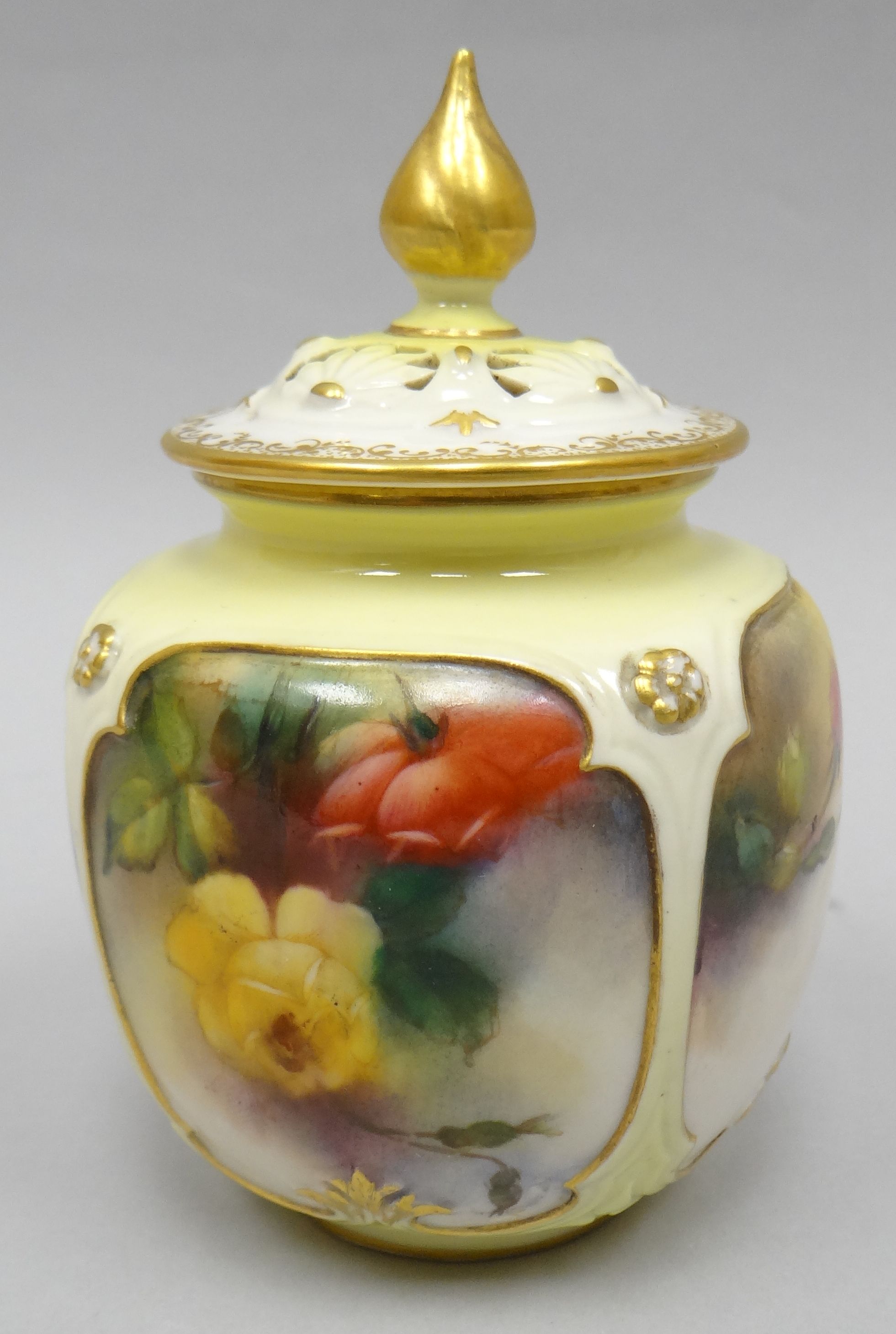 A Royal Worcester 'Hadley Ware' panelled pot pourri with pierced lid having a gilded finial, the