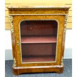 A mid-Victorian figured walnut pier-cabinet, the top with rounded corners, tulipwood cross-banding