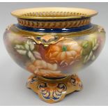 A Hadley's of Worcester blush footed vase with reticulated neck, the body painted all-round with