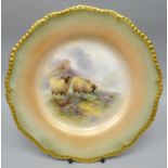 A Royal Worcester blush ivory cabinet plate of fluted-circular form and with moulded gilt rim, the