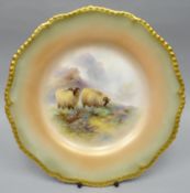 A Royal Worcester blush ivory cabinet plate of fluted-circular form and with moulded gilt rim, the