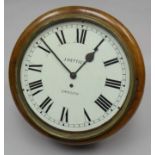 A good turn-of-the-century mahogany encased circular dial pendulum-wall clock with fusee movement,