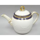 A late eighteenth century circular-based Derby porcelain teapot having a moulded body, gilt and blue