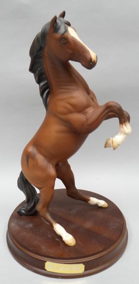 A Royal Doulton sculpture of a rearing horse 'Spirit of the Wild' in matt finish on a circular