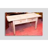 An elm top and pine base two drawer farmhouse table, the three boarded top with cleated and