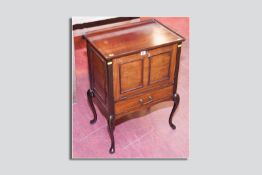 An Edwardian mahogany tray top music cabinet with single drawer below on Queen Anne supports, 27.5 x