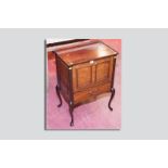 An Edwardian mahogany tray top music cabinet with single drawer below on Queen Anne supports, 27.5 x