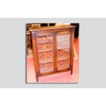 An oak leaded twin glazed door bookcase, 46 x 36 ins (117 x 91.5 cms)