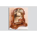 A good Victorian mahogany swing toilet mirror, a central shaped top mirror with flanking carved