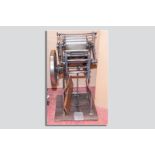 An Adana TP48 10 x 8 foot operated printing press