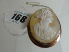 An oval cameo head and shoulders portrait brooch in a believed 9ct yellow gold frame
