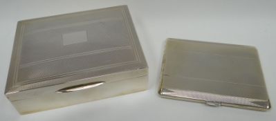 A guilloche decorated silver cigarette box with wooden liner, Birmingham 1975, together with a
