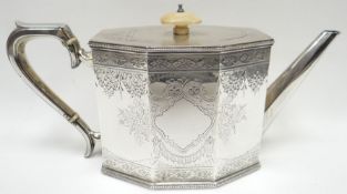 A Victorian bright-cut silver octagonal-based teapot with ivory knop and conductor, s-shaped