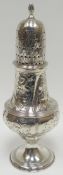 A George III floral and swirl embossed silver baluster-shaped pedestal caster, London 1813, 2.5ozs