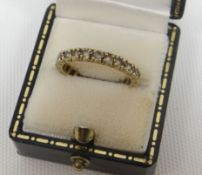 A 9ct yellow gold multi-diamond eternity ring, 2.35gms