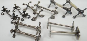 A collection of five pairs of miscellaneous white metal / part-white metal knife rests