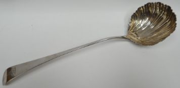 A George III long-handled soup-ladle with shell-bowl and having an engraved 'elephant and castle'
