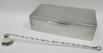 An Asprey's silver rectangular machine-turned cigarette-box, having a divided wooden interior,