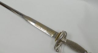 A Wilkinson Sword of London ceremonial sword with silver hilt and silver wirework grip, the straight