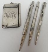 A silver monogrammed aide de memoire; together with three silver barrelled pencils including 'Yard
