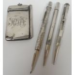 A silver monogrammed aide de memoire; together with three silver barrelled pencils including 'Yard