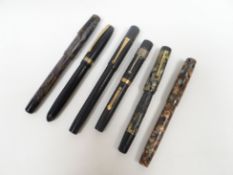 Six vintage fountain pens with gold nibs including a mottled-barrel 'Jackdaw' and similar 'Stephens'